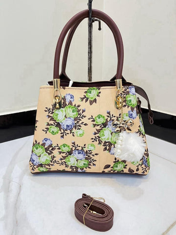 Elegant Floral Pattern Handbag with Stylish Handle and Charm Accent